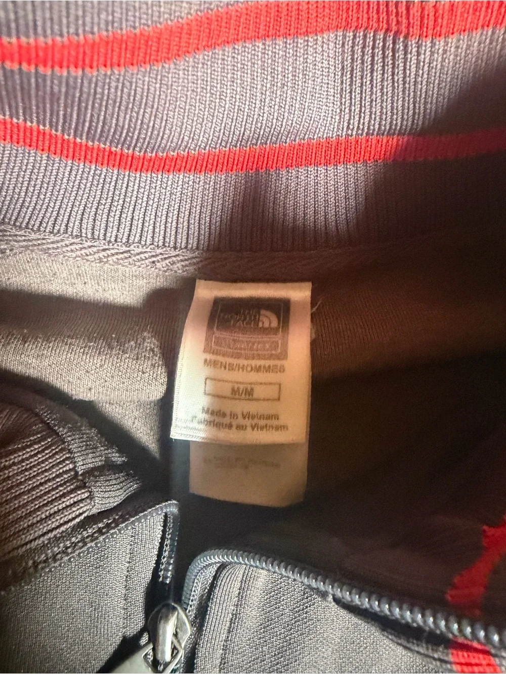 The North Face Black Jacket with Red Stripe Accents